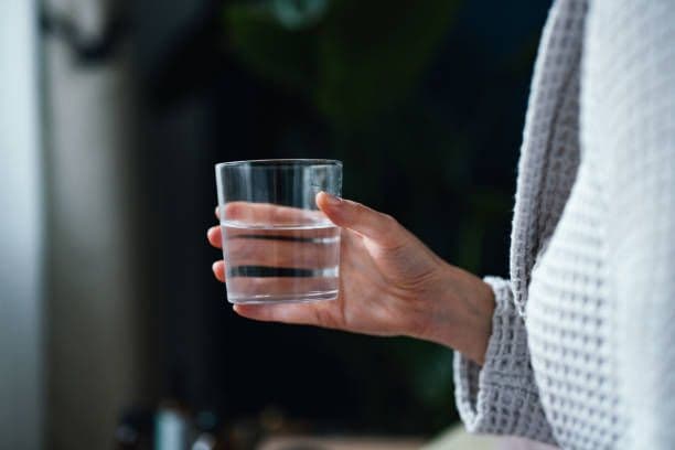 Stomach Hurts After Drinking Water? Here's What It Could Mean
